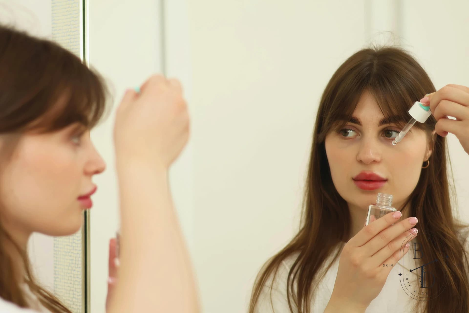 Applying hydrating serum to skin